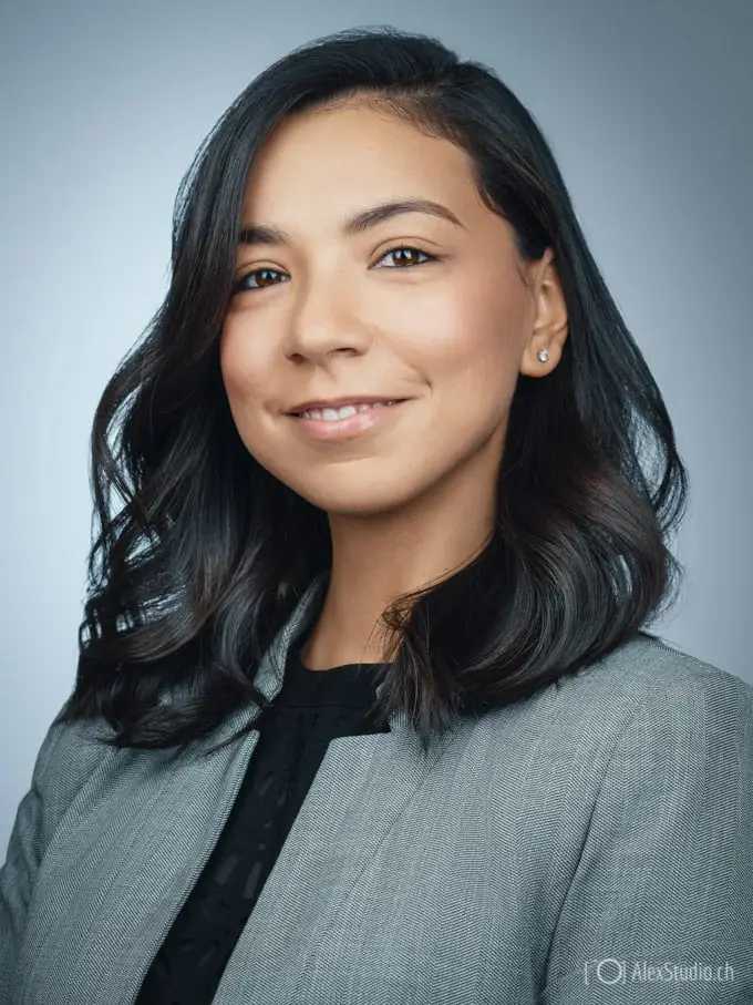 Woman's portrait taken by Photographer in Geneva in Professional Studio for CV, Resume or LinkedIn on grey Background by Photographer Alex Petrenko