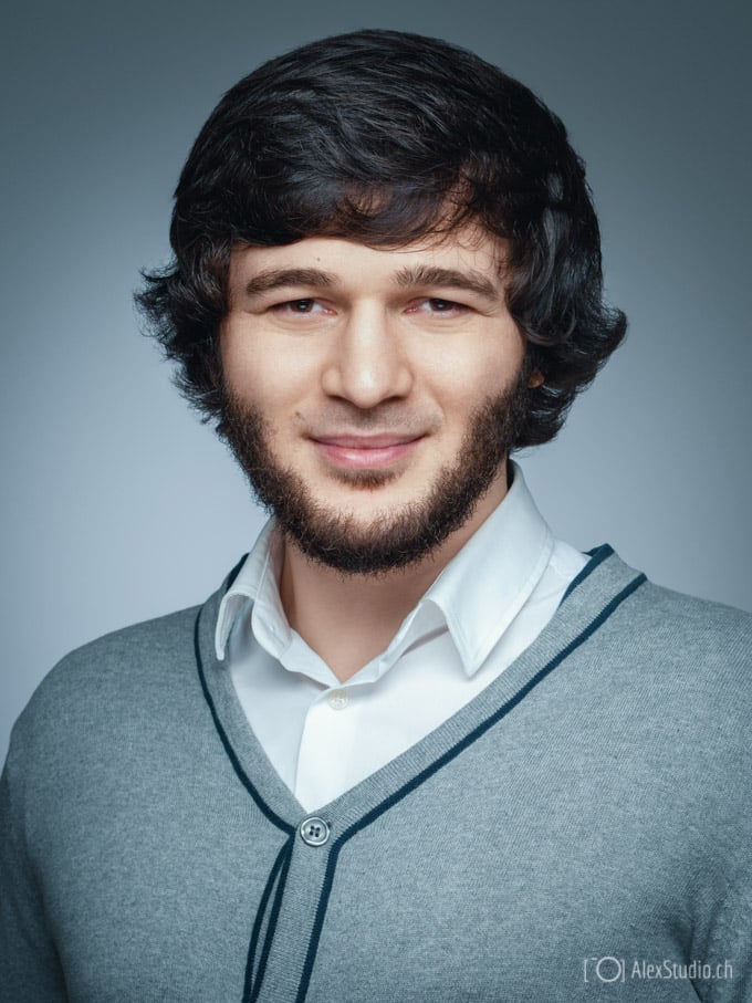 Man's portrait taken by Photographer in Geneva in Professional Studio for CV, Resume or LinkedIn on gray Background by Photographer Alex Petrenko
